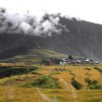 Mountainous landscape with clouds with house and terraces