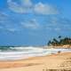 Couple on the Beach in Brazil under blue sky