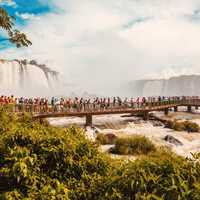 People on the walkway overlooking Iguazu Falls