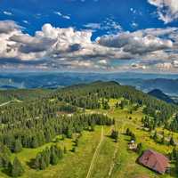 Scenic landscape with mountains under clouds and sky