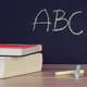 Books and Chalkboard with ABC