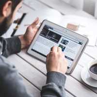 Man Working on Tablet