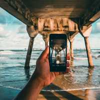 Person taking picture of the dock with I-phone