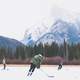 People playing Hockey on frozen lake in Banff National Park, Alberta, Canada