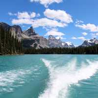 Mountain and lake landscape behind the boat in Jasper National Park, Alberta, Canada