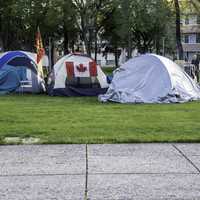 People protest camping on the lawn downtown in Winnipeg