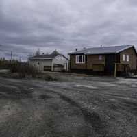 Houses under the cloudy skies in Dettah