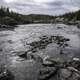 Landscape and Scenery of the Cameron River under clouds and forest