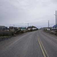 Road into Dettah under cloudy skies on the Ingraham Trail