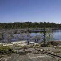 Shoreline and trees surrounding Pontoon Lake on the Ingraham Trail