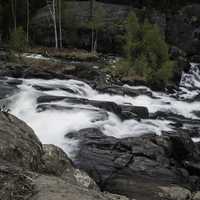 Time-Lapse of cascading water splashing down rocks at Cameron Falls, Ingraham Trail