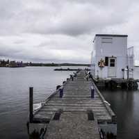 Docks out to the barge under clouds in Yellowknife