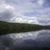 Clouds, lake, water, and trees at Algonquin Provincial Park, Ontario