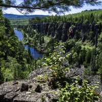 Guy Ziplining down Eagle Canyon, Ontario, Canada