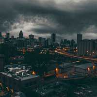 Black Clouds over the Night Time Cityscape of Montreal, Quebec, Canada
