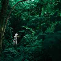 Person in suit in the forest in Nuns' Island, Montreal, Canada