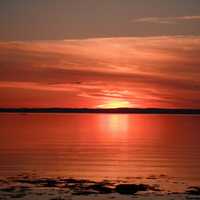 Red Sunset over the Seas in Quebec, Canada