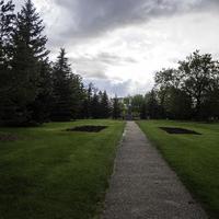 Path in the city park under dark skies in Saskatoon