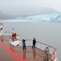 People looking at Hubbard Glacier in the Yukon