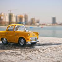 Small Yellow Car on the beach