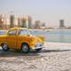 Small Yellow Car on the beach