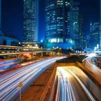 Lighted Up Roads at Night with skyscrapers in Hong Kong, China