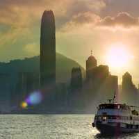 Sun setting behind skyscrapers in Hong Kong