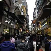 People moving up the street in Macau