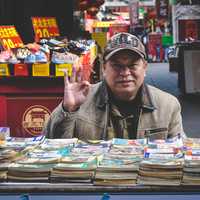 Man selling Books in the marketplace in Tianjin, China