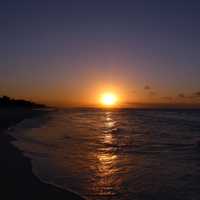 Sunset over the ocean with purple sky in Cuba