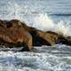 Waves crashing over the rocks in nature in Cuba