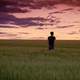 Man standing in the grassy field in Prague, Czech Republic