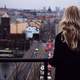 Woman overlooking the city of Prague, Czech Republic