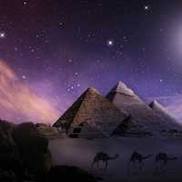 Pyramids with bright moon and stars