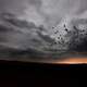 Birds Migrating under the clouds at dusk