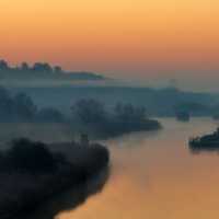 Dawn on the river on a misty morning