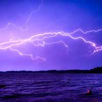 Lightning Across the sky over the water