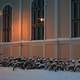 Snowy bicycles in front of library of architecture of Oulu University in Finland