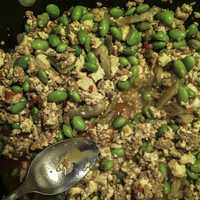 Beans, tofu, and pork being stir fried