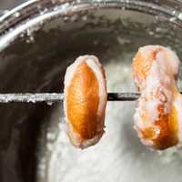 Donuts being glazed