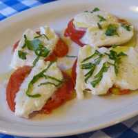 Eggs and Omelet on top of Tomatoes