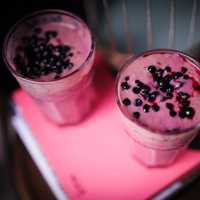 Glass of Pink yogurt with berries