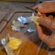 Hands Peeling Garlic with knife 