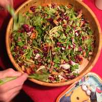 Mixing Salad with Onions with greens and carrots