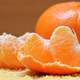 Peel and un-peeled orange