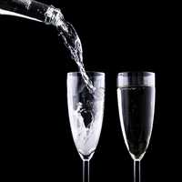 Pouring two cups of sparkling wine