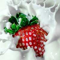 Strawberry splashing in milk