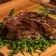 T-Bone Steak on some green leaves