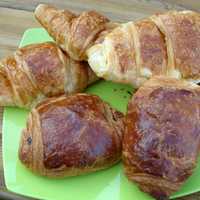 Tasty croissant dish on Green Plate
