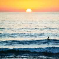 Seascape with sun setting over the waters